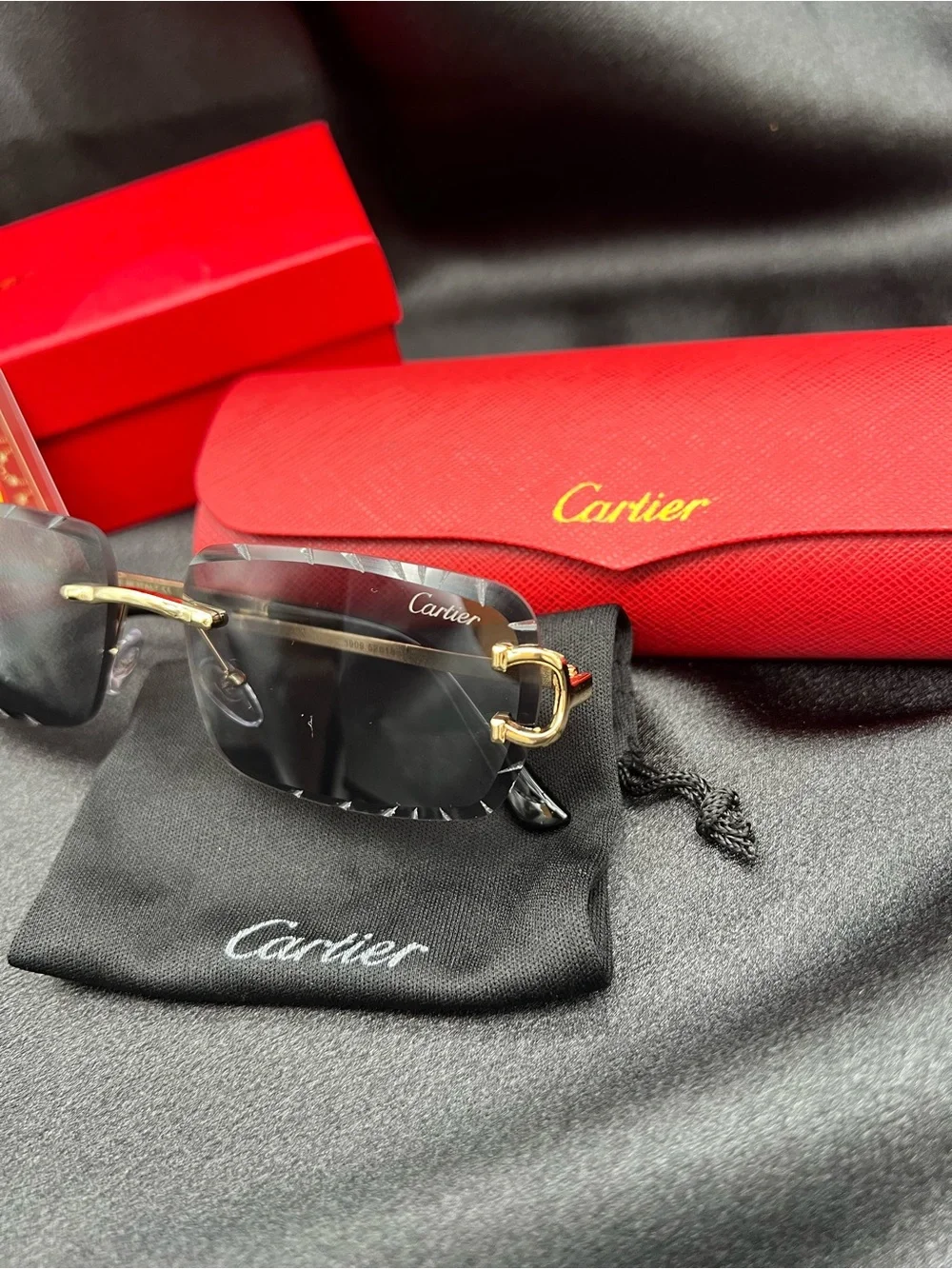 Cartier Men's Black & Gold Rimless Sunglasses with Scalloped Lenses